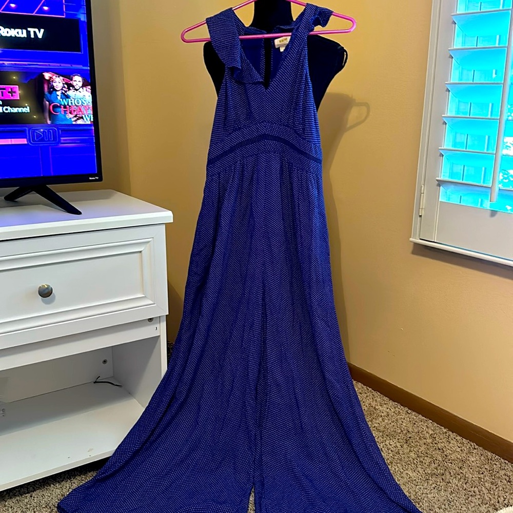 Super cute, jumpsuit, in the stunning blue/ purple color. Worn, but great shape